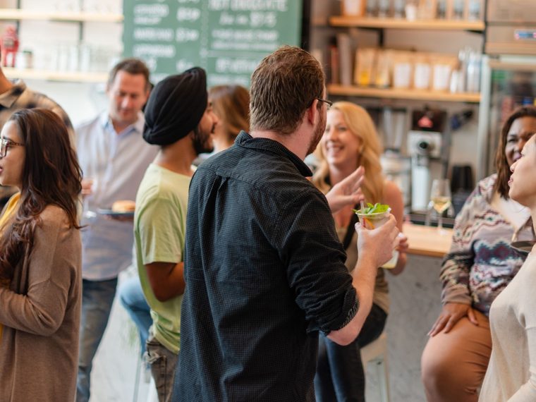 Neighbours chatting over coffee at a local cafe